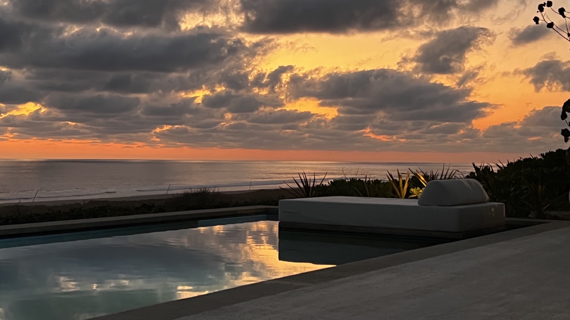 Dramatic sunset sky over the pool